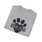 Folded gray t-shirt with 'DOG DAD' and paw print design on a white background